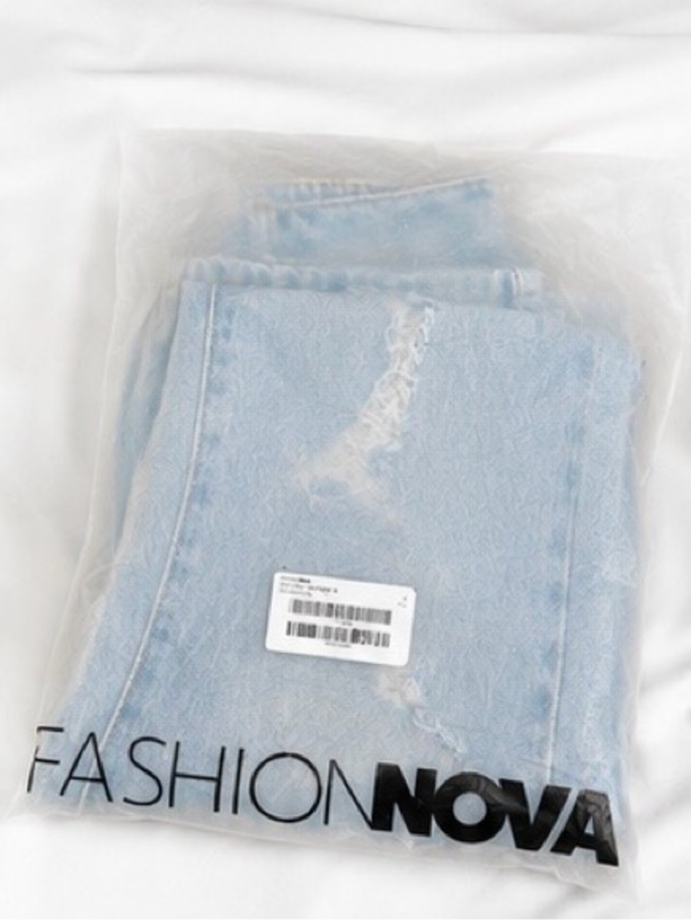 Fashion Nova Pale Blue Distressed Denim Jeans